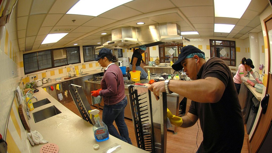 Detailed scrubbing during a deep clean of a kitchen