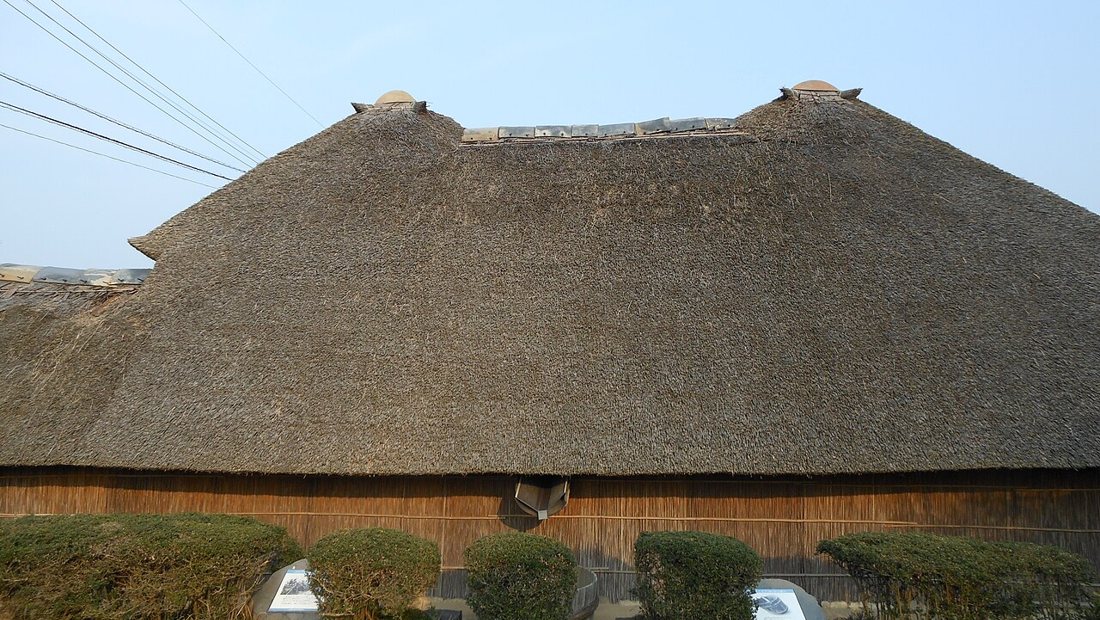 Gutters along the roofline of a typical house