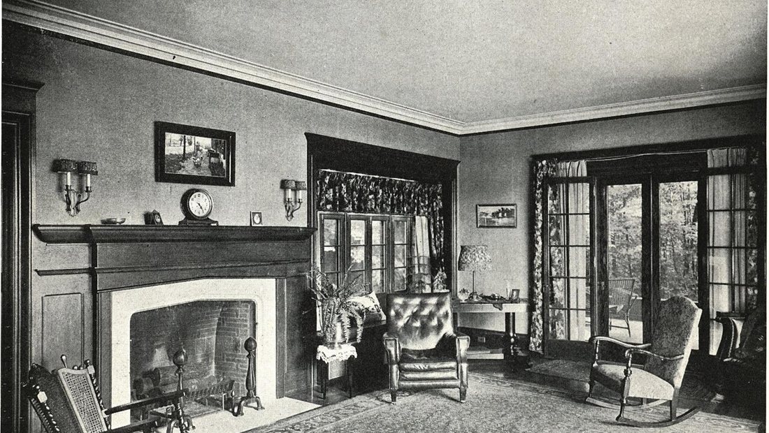 A professional cleaner finishing a tidy living room