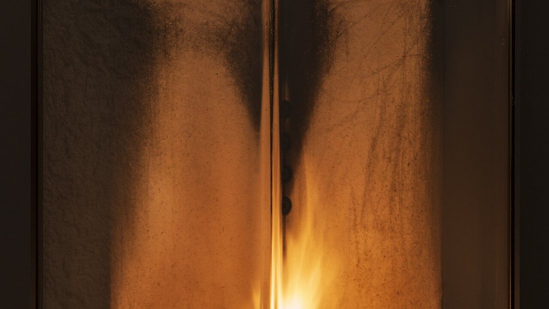 A clean wood-burning stove with clear glass